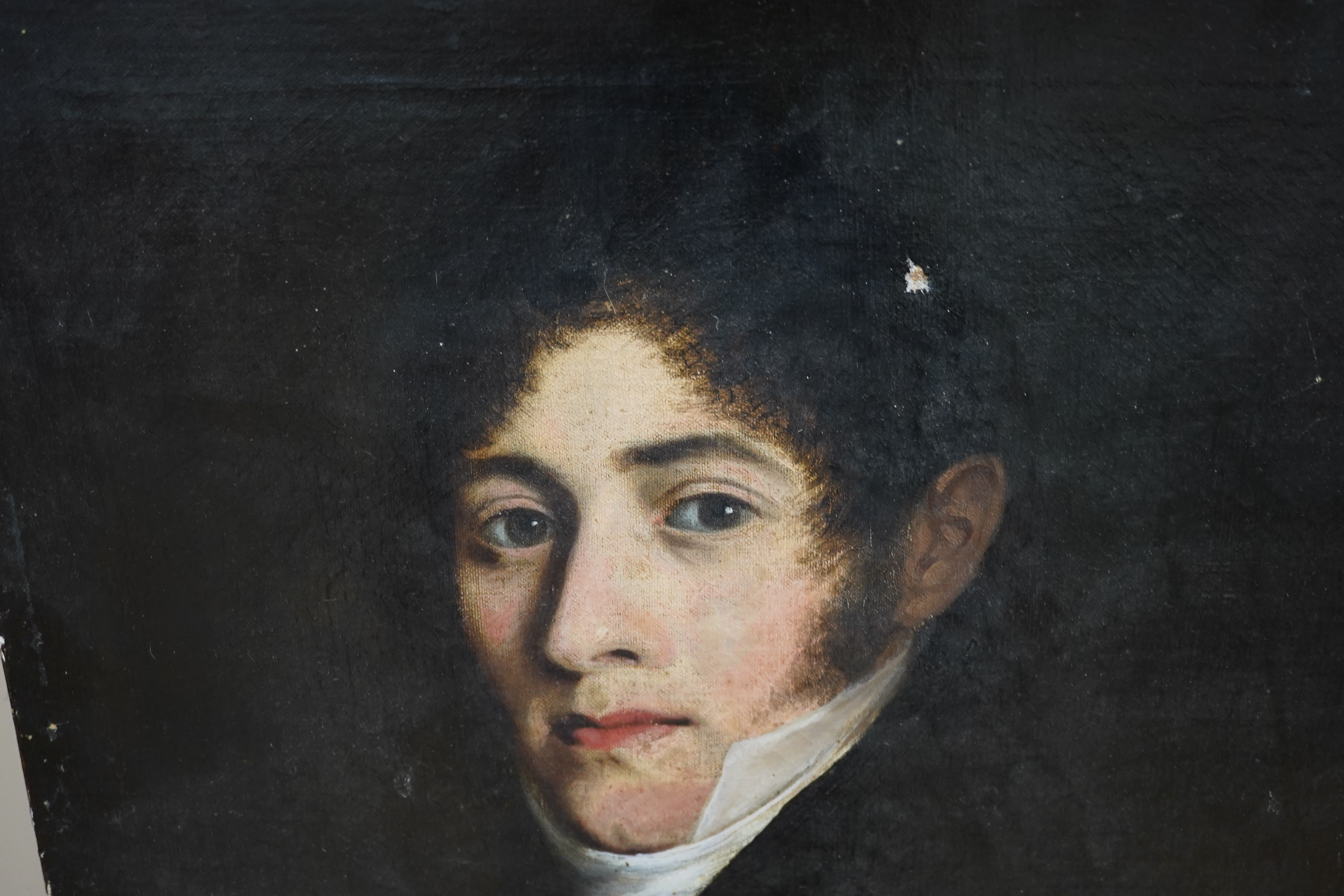 19th century English School, oil on canvas, Head and shoulders portrait of a gentleman wearing a cravat, unsigned, 61 x 47cm, unframed. Condition - fair